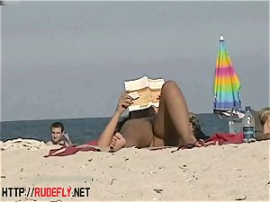 red-hot stunners filmed lying on a naturist beach